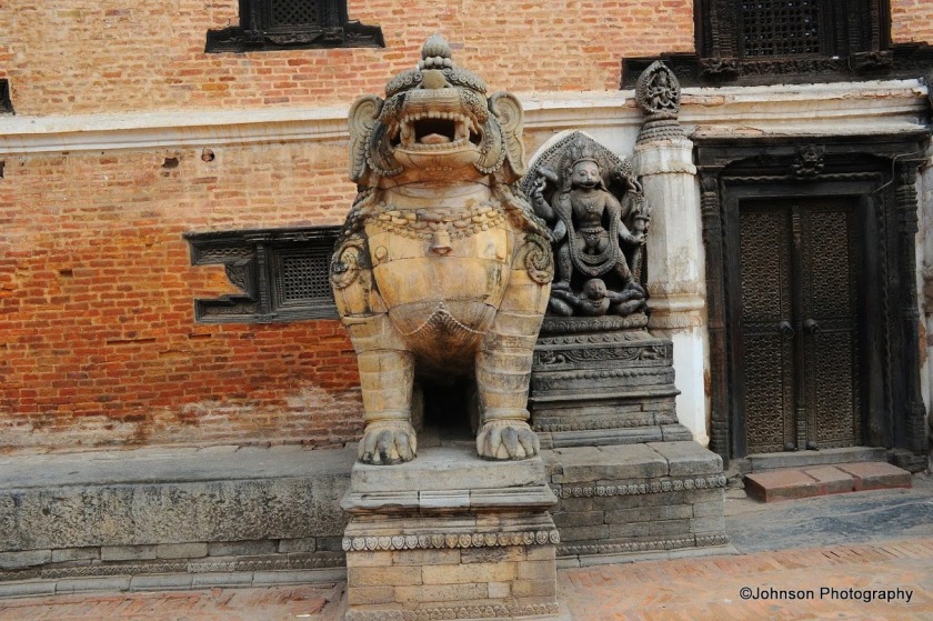 Bhaktapur Durbar Square - The guardian figure at the entrance of the 55 window palace 