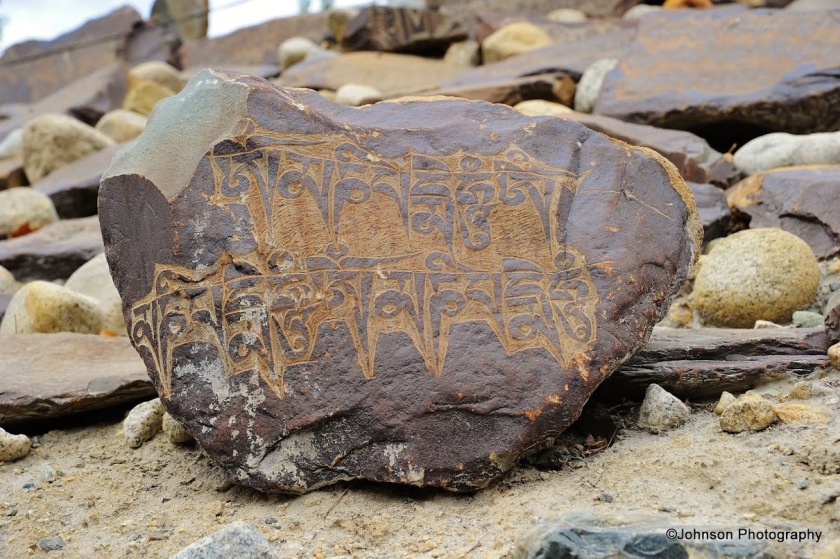 A Mani stone engraved in the elegant Tibetan script 
