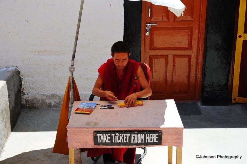 The monk issuing the entry tickets to the monastery 